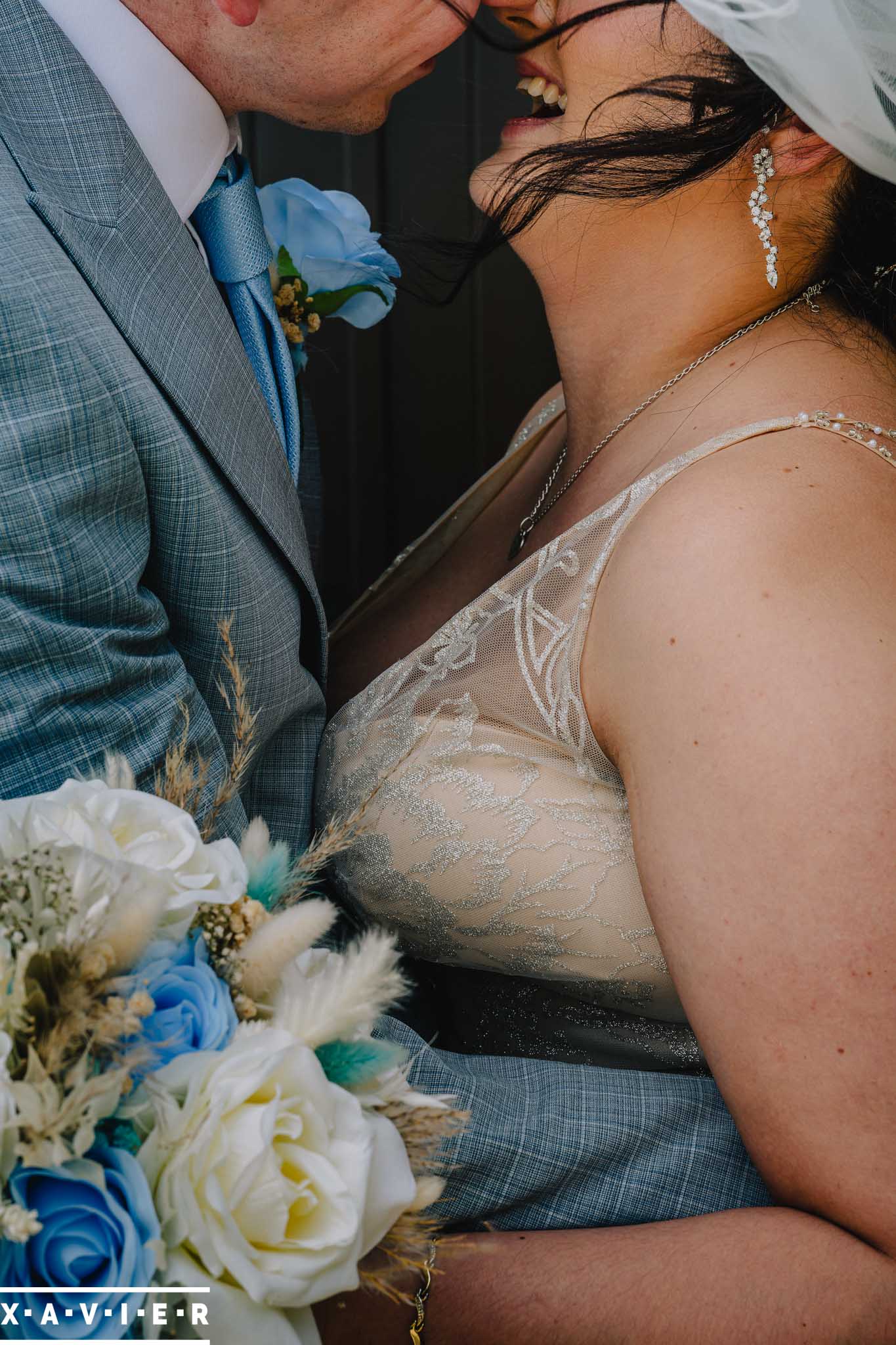 bride and groom pull each other close
