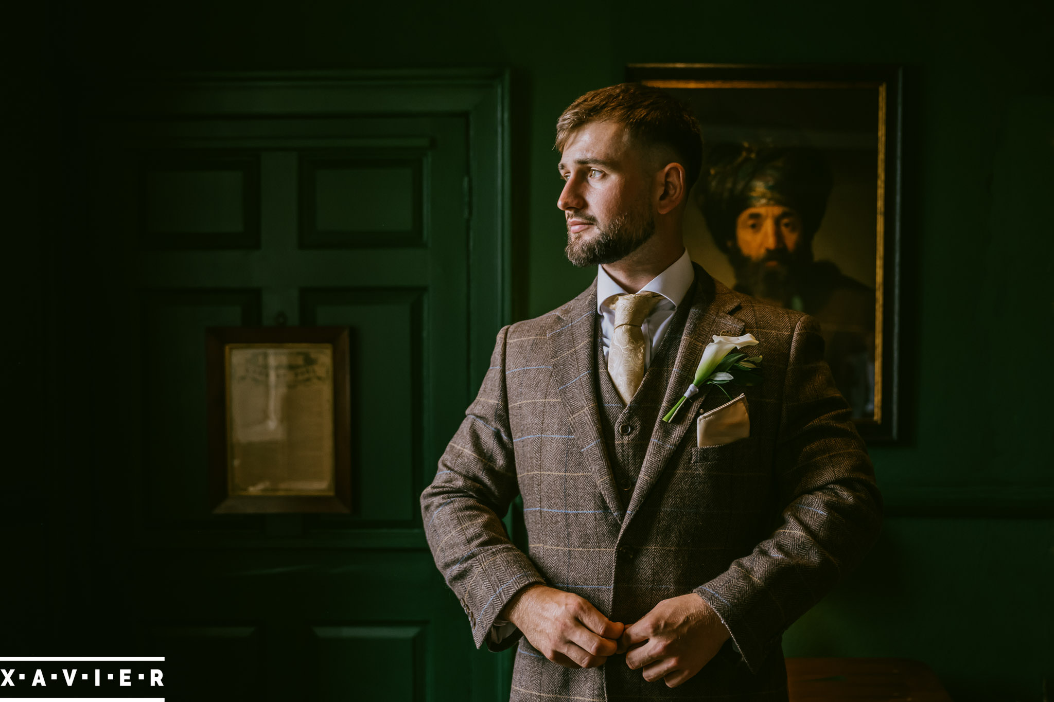 groom getting ready at swinton park wedding venue in ripon