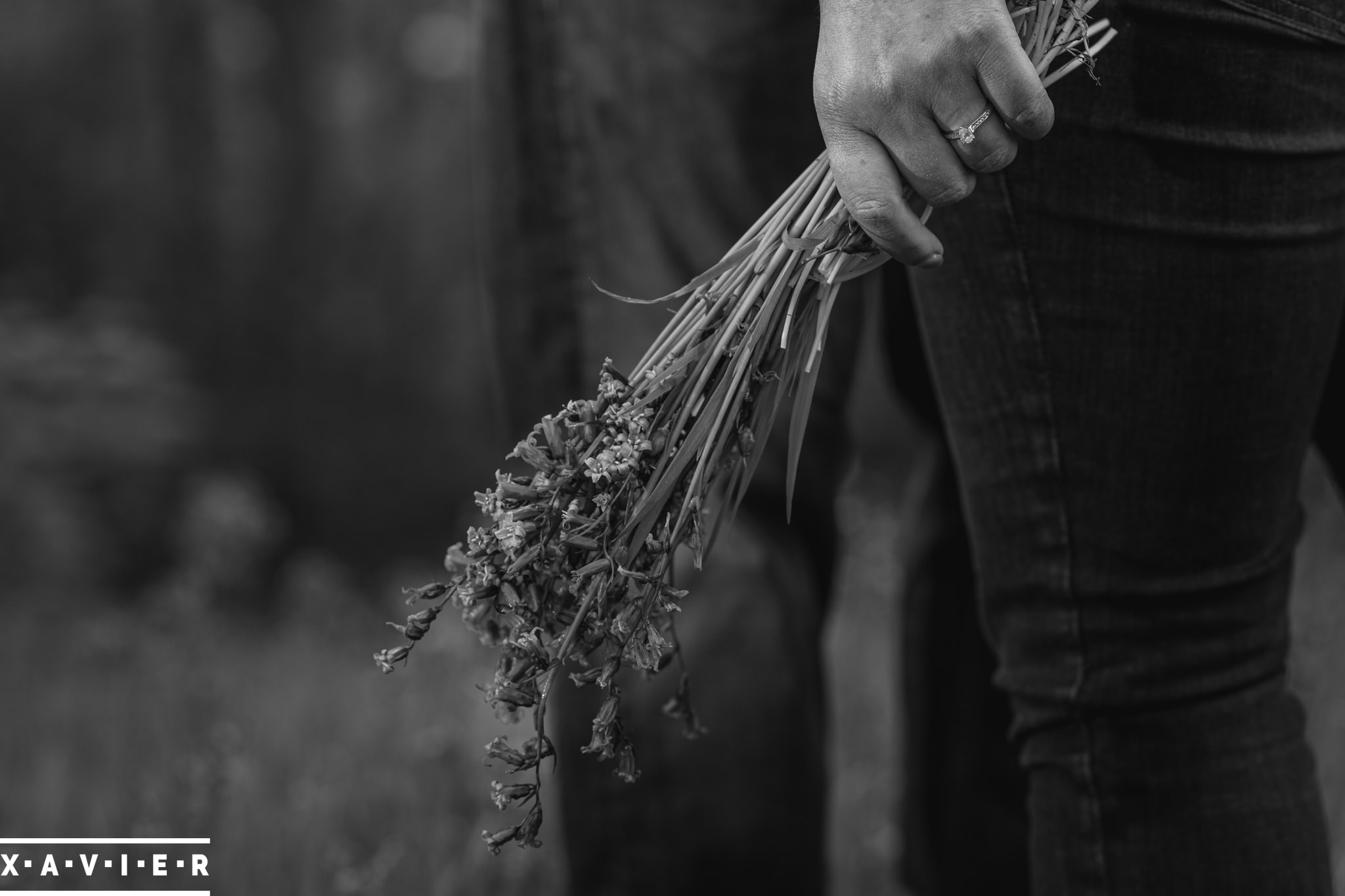 close up of bride-to-be holding bluebells during engagement shoot