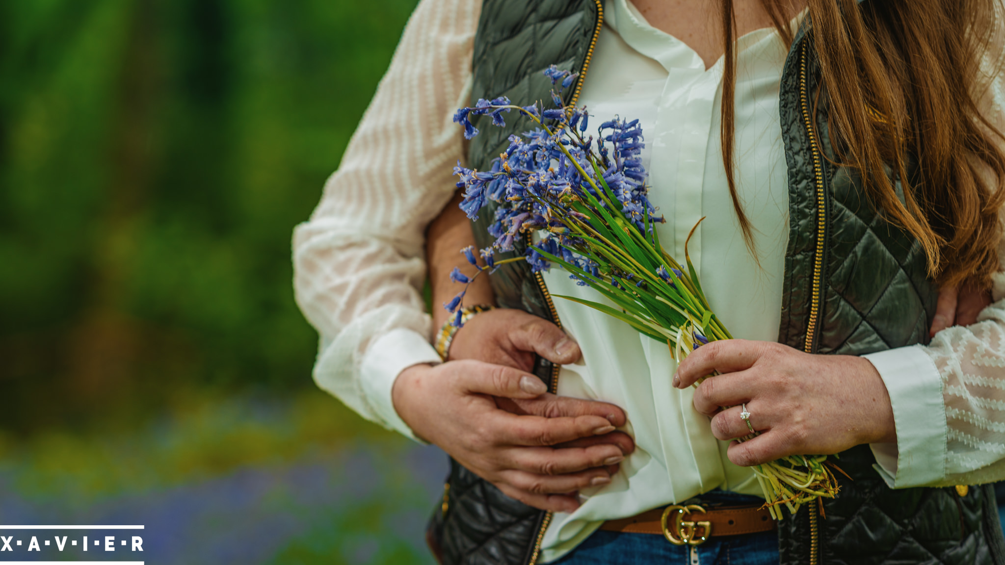 couple holding bluebells during engagement photography connection session