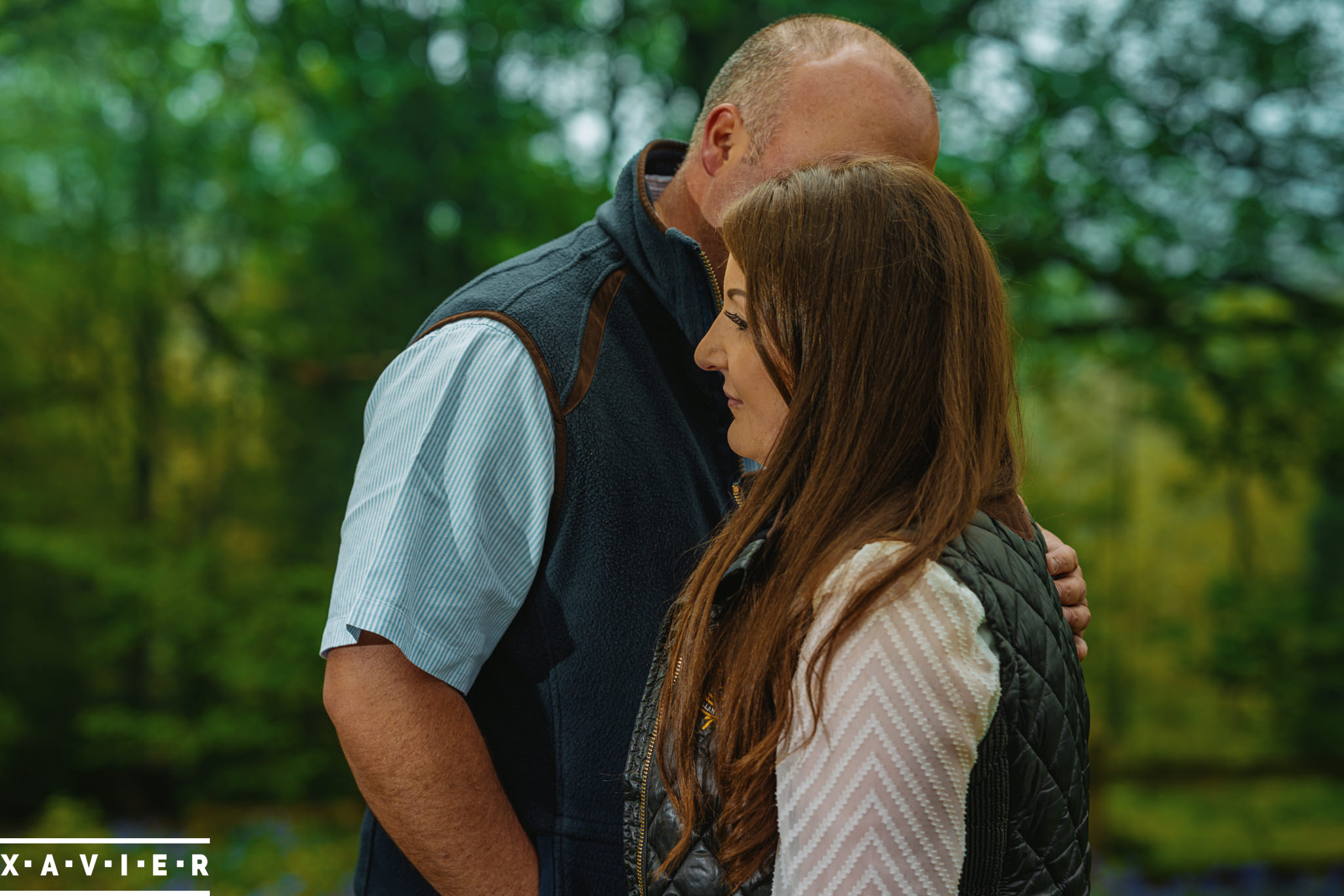 romantic posing amongst the bluebells suring engagement photography session