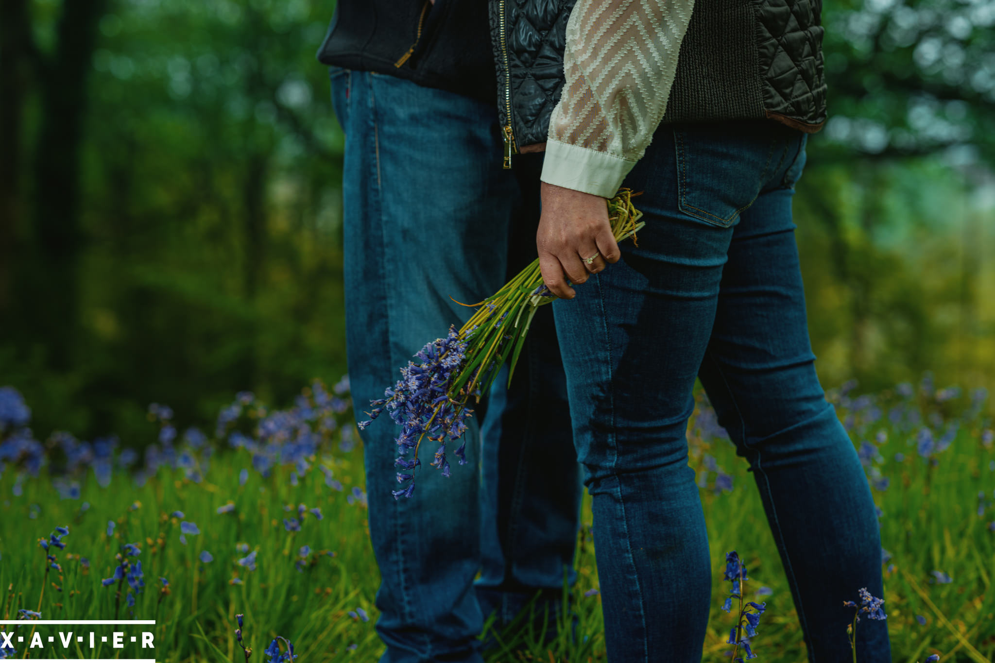 holding bluebells during engagaement photography in yorkshire