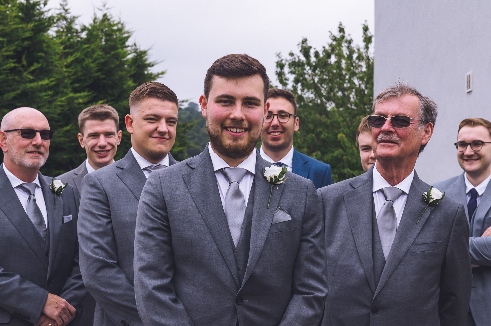 The groomsmen are lined up for the photo