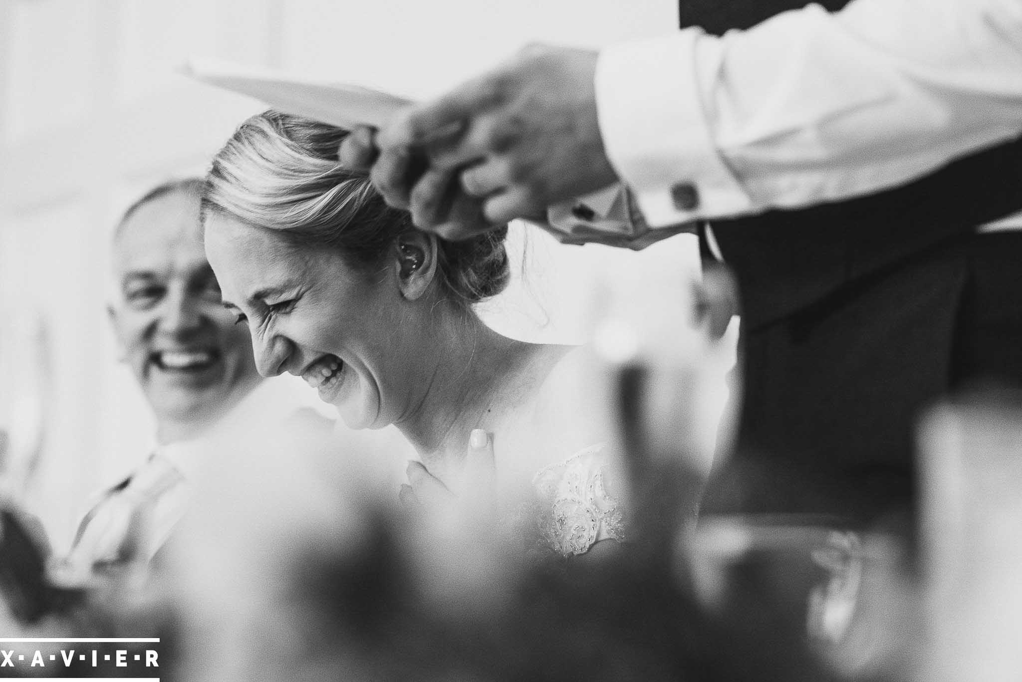 bride laughing during the speeches