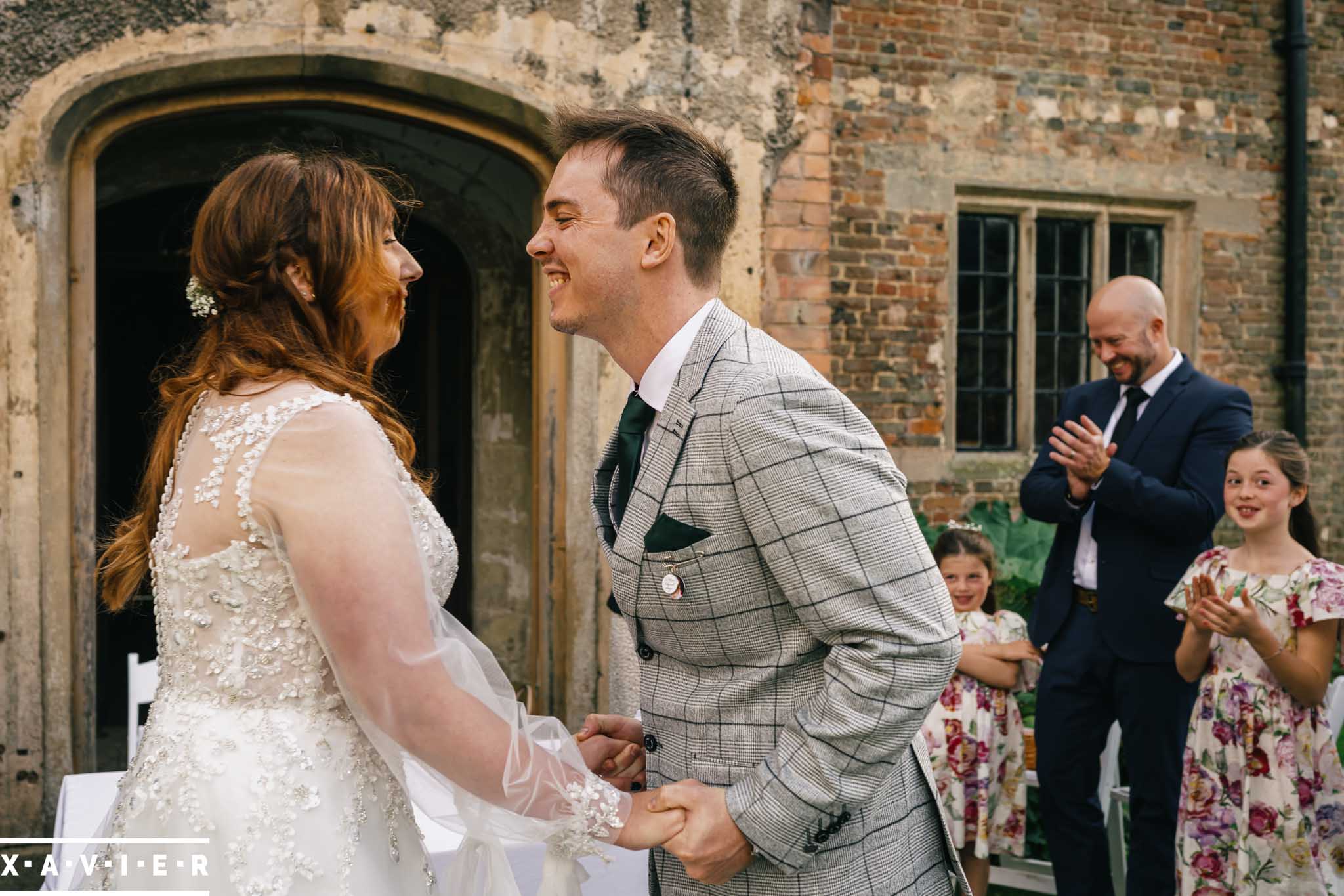 bride and groom kiss in the courtyard