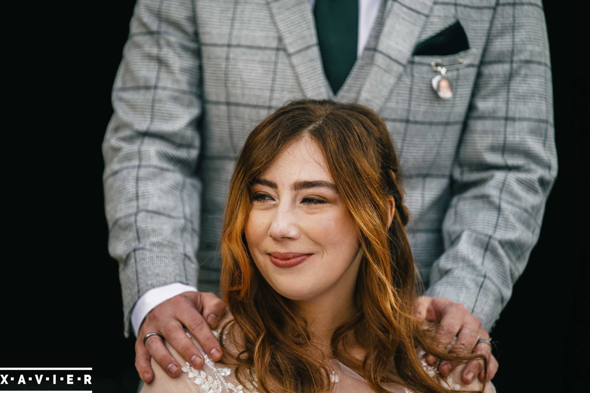 groom holds the bride
