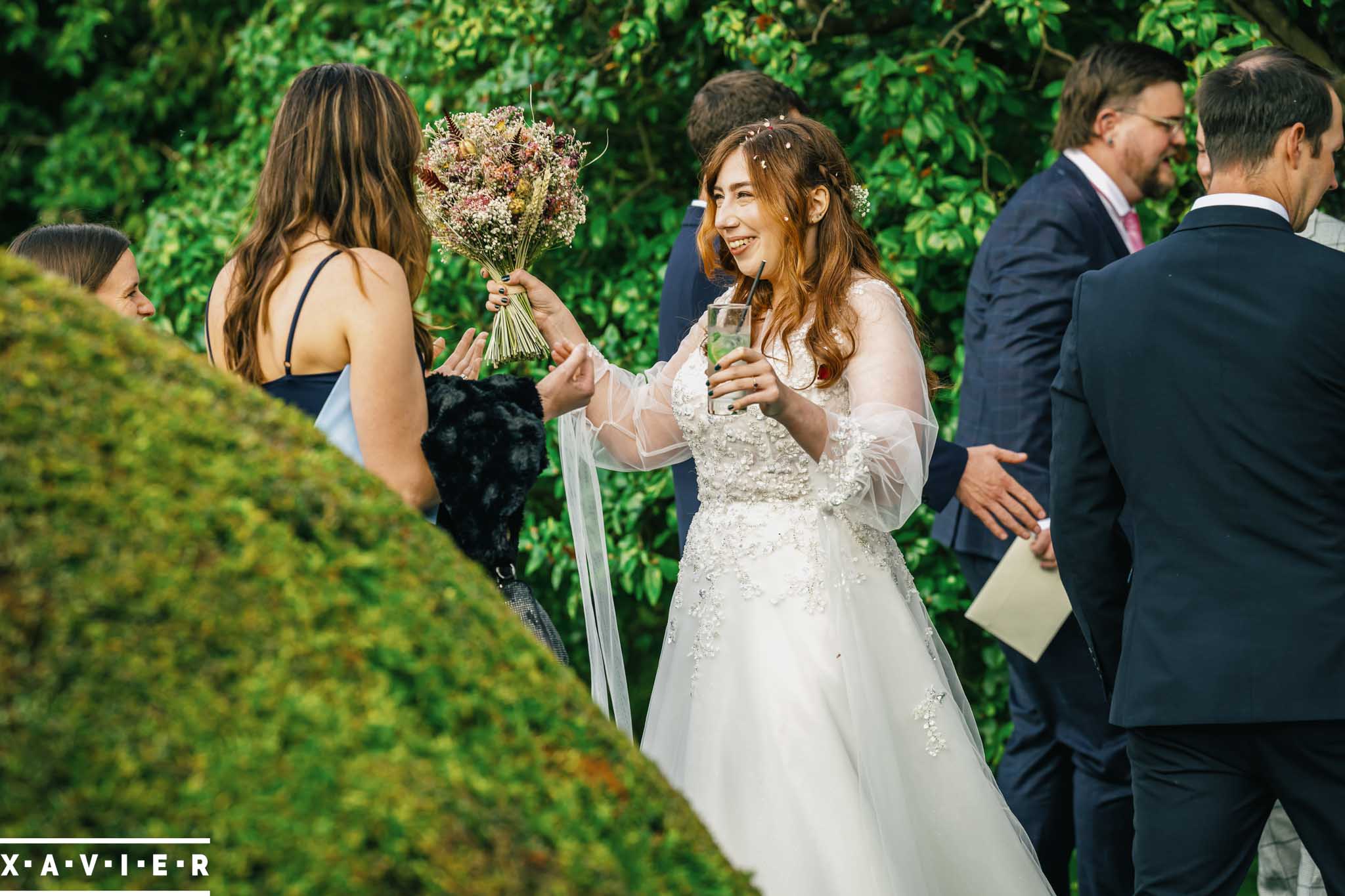 bride and groom are covered in confetti