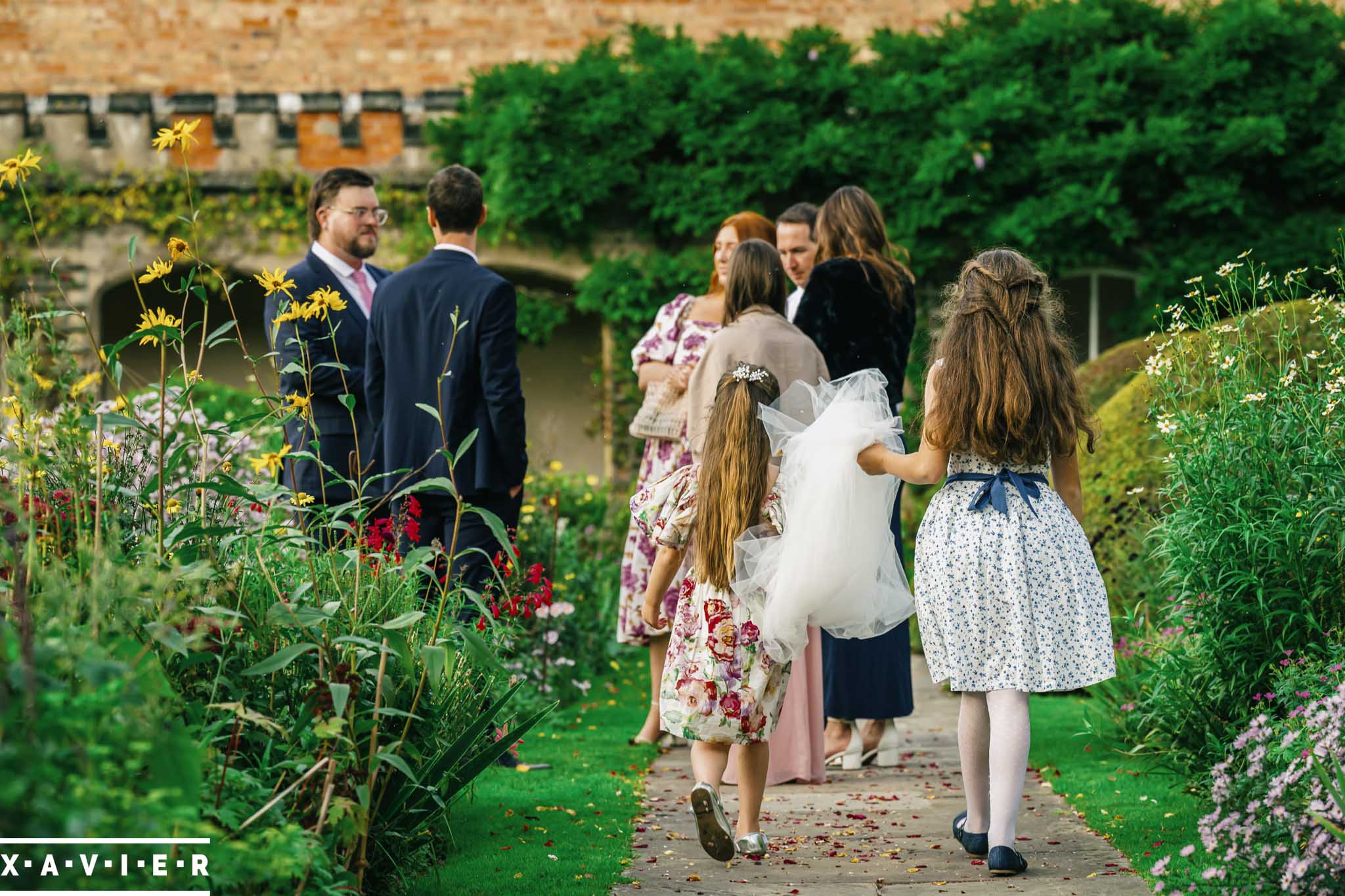 bride and groom laughing with guests