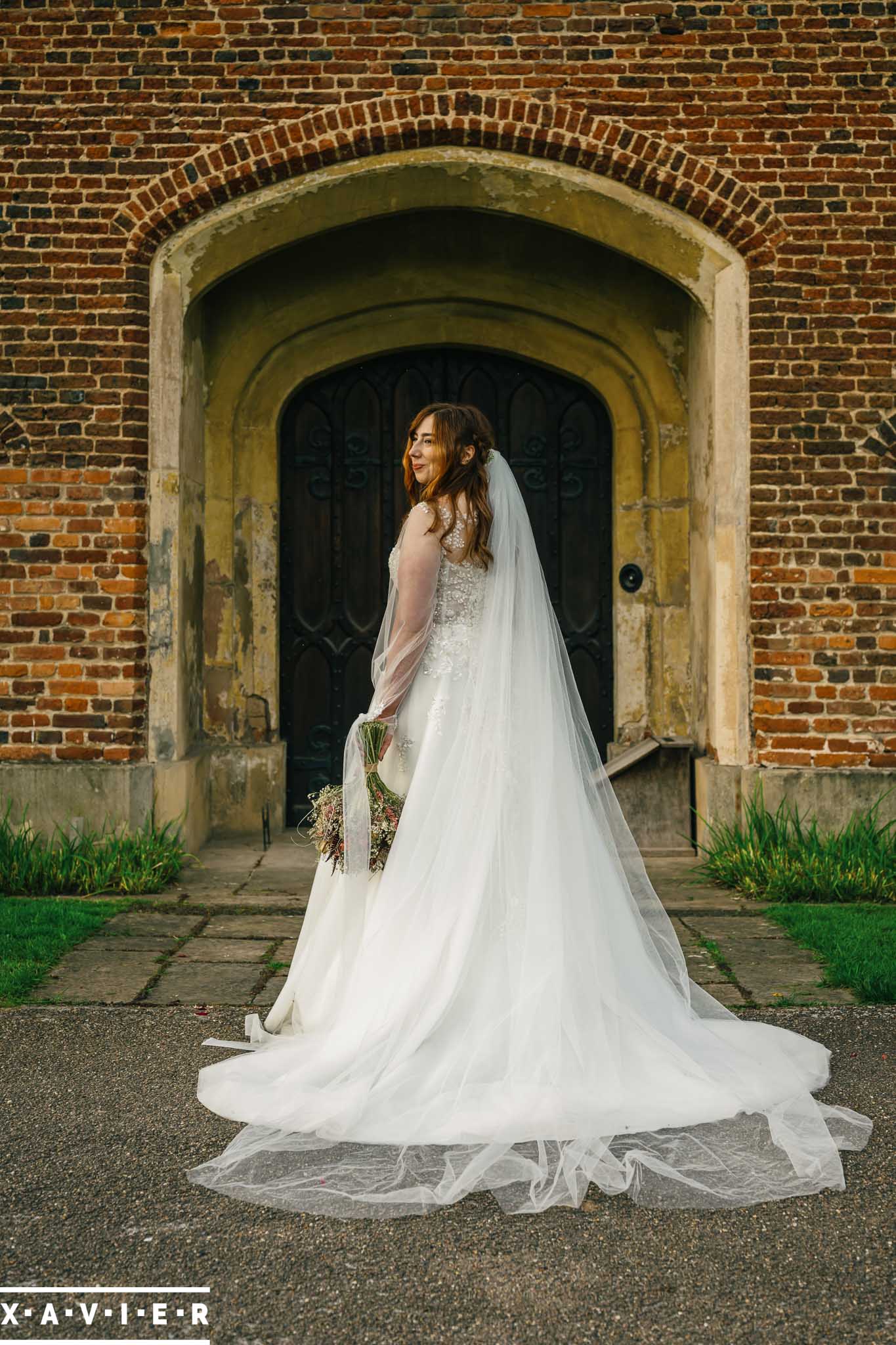 wind blows brides veil off her head