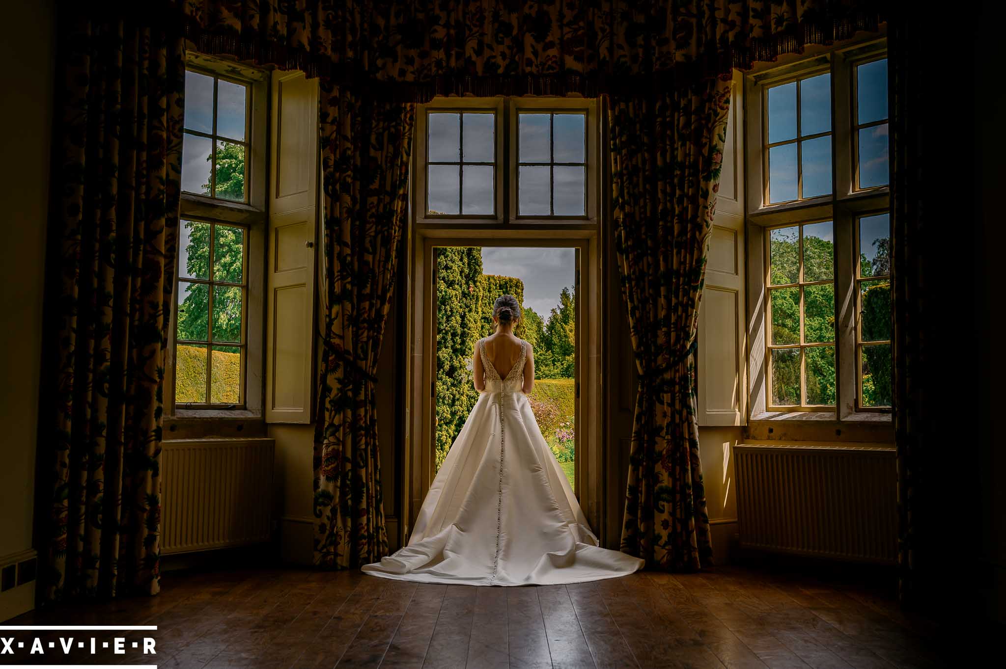 Bride stands with her back to the camera