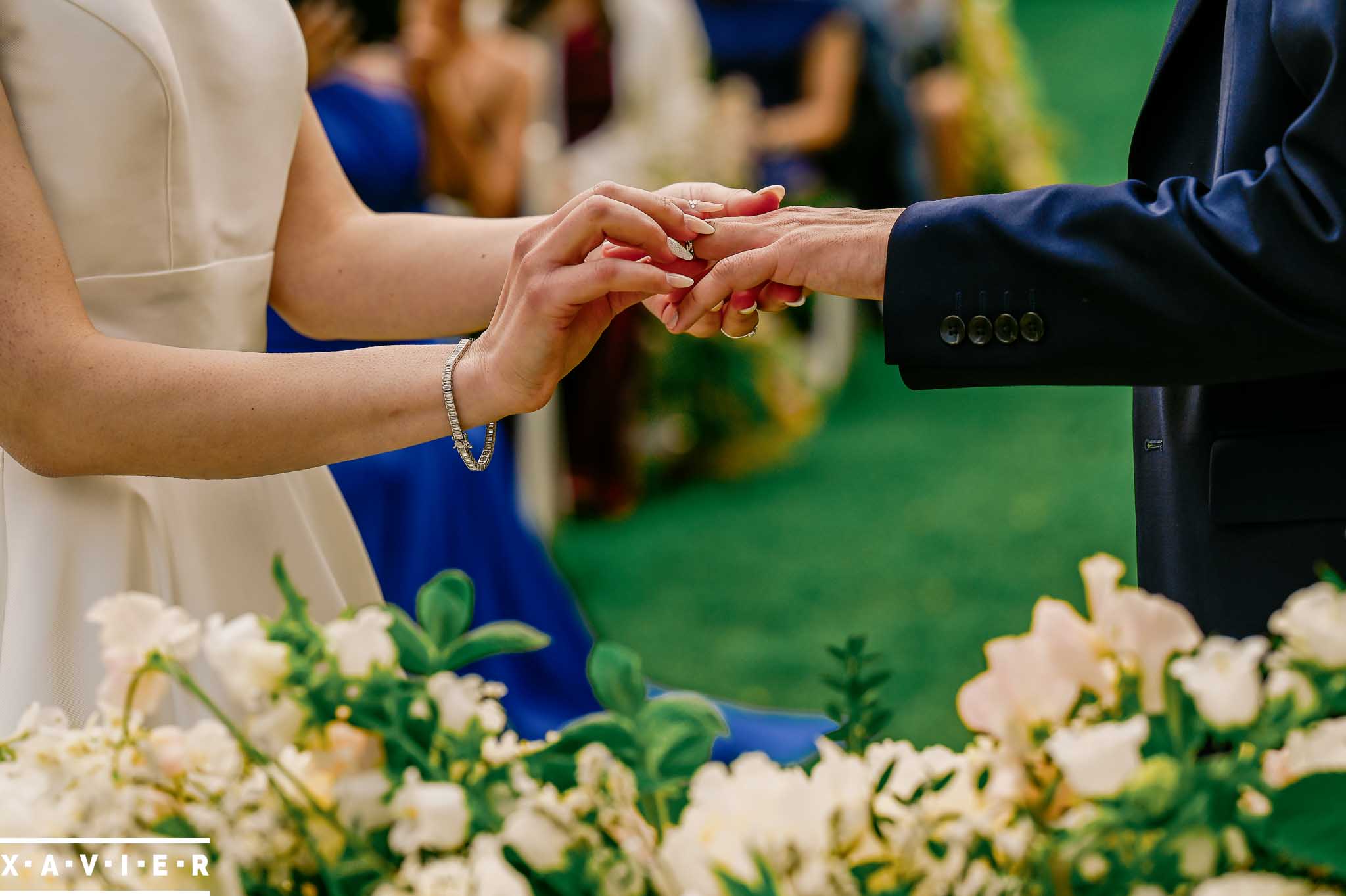 bride and groom exchange rings