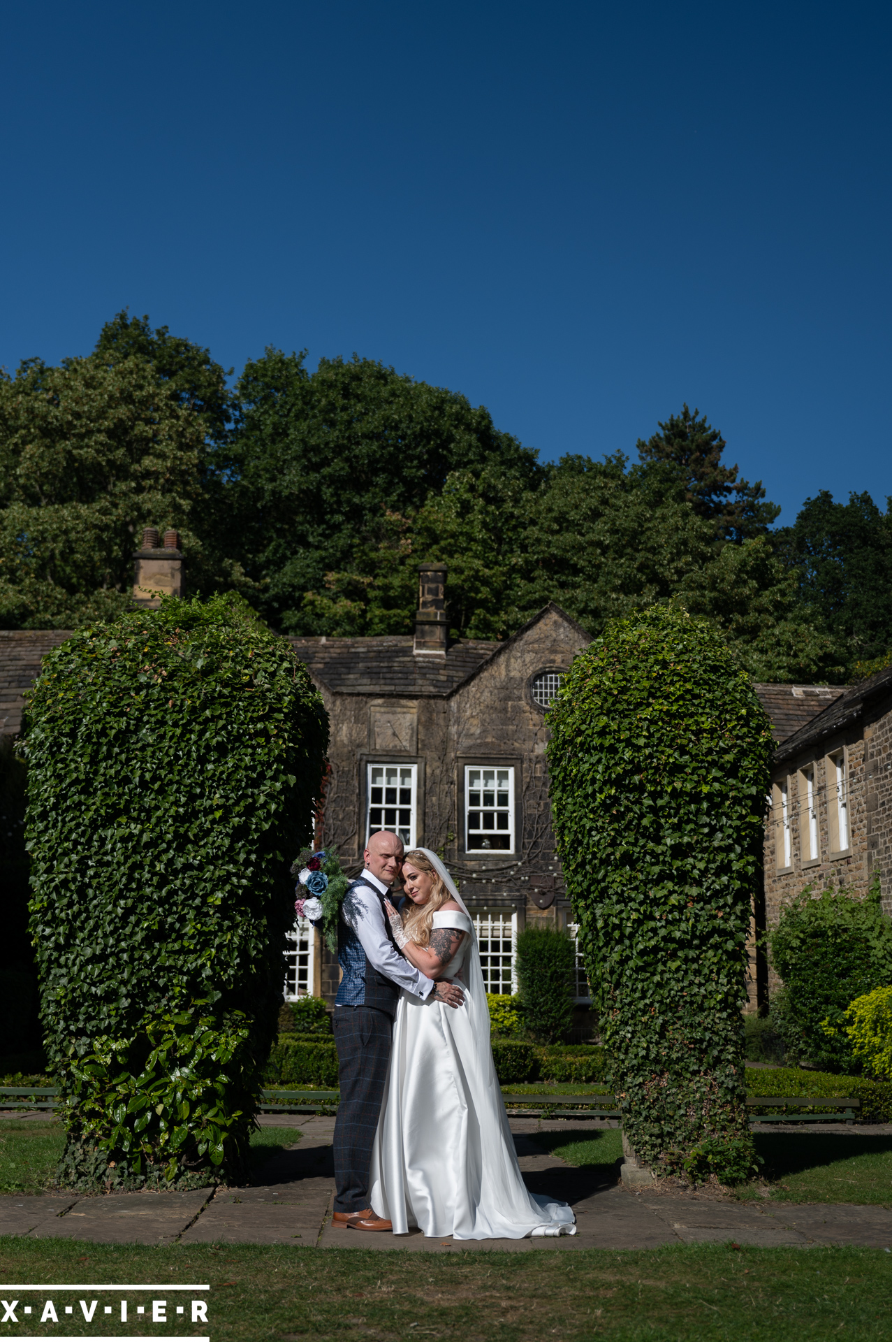 bride and groom in the garden at whitley hall hotel