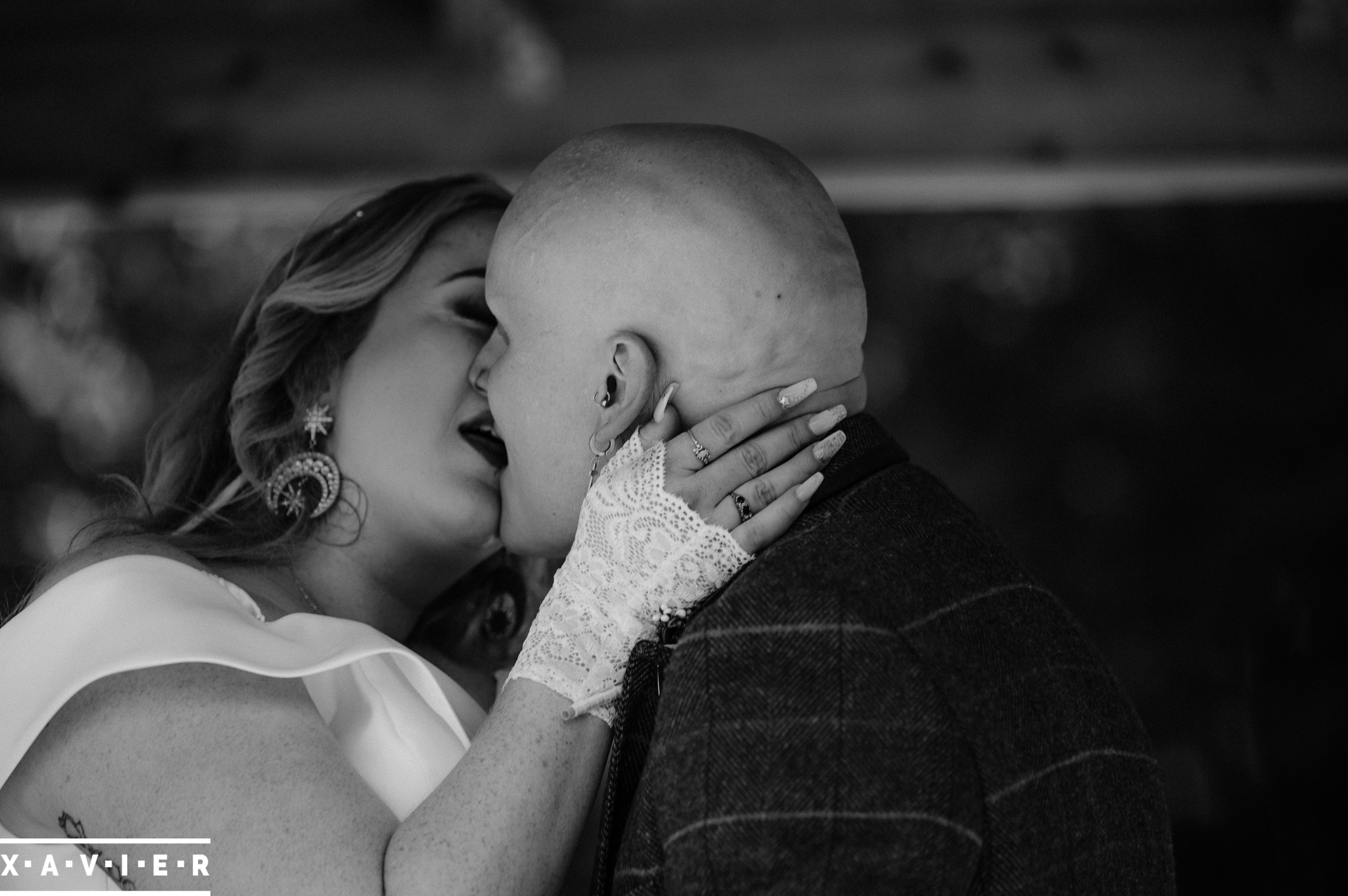 bride and groom have their first kiss