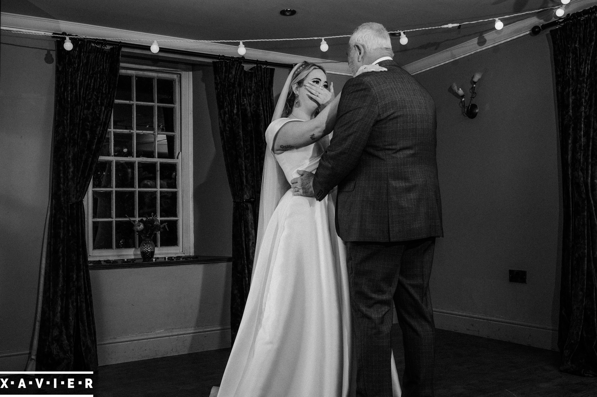 bride is tearful as she dances with her father