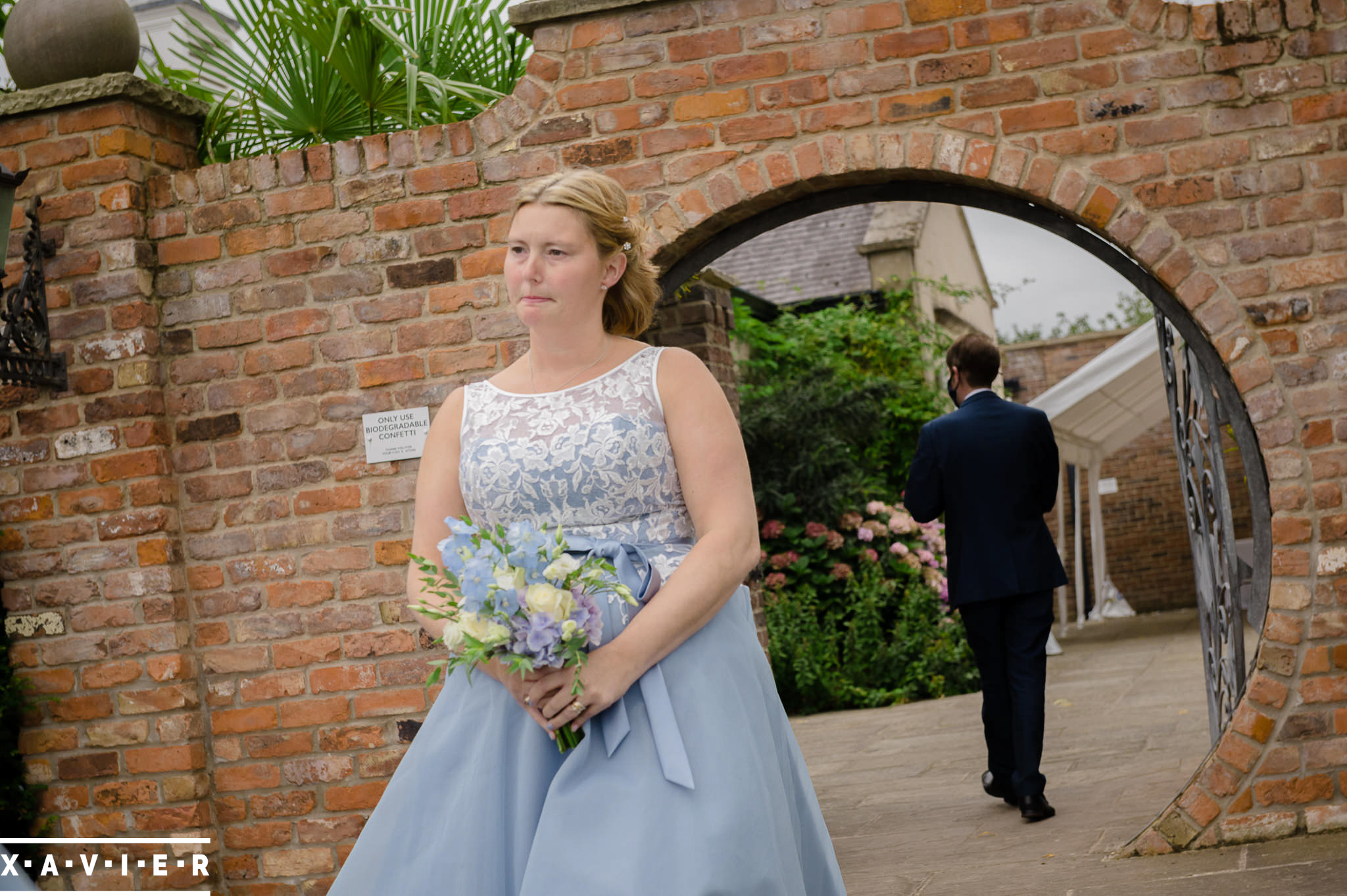 bridesmaid walks to the ceremony