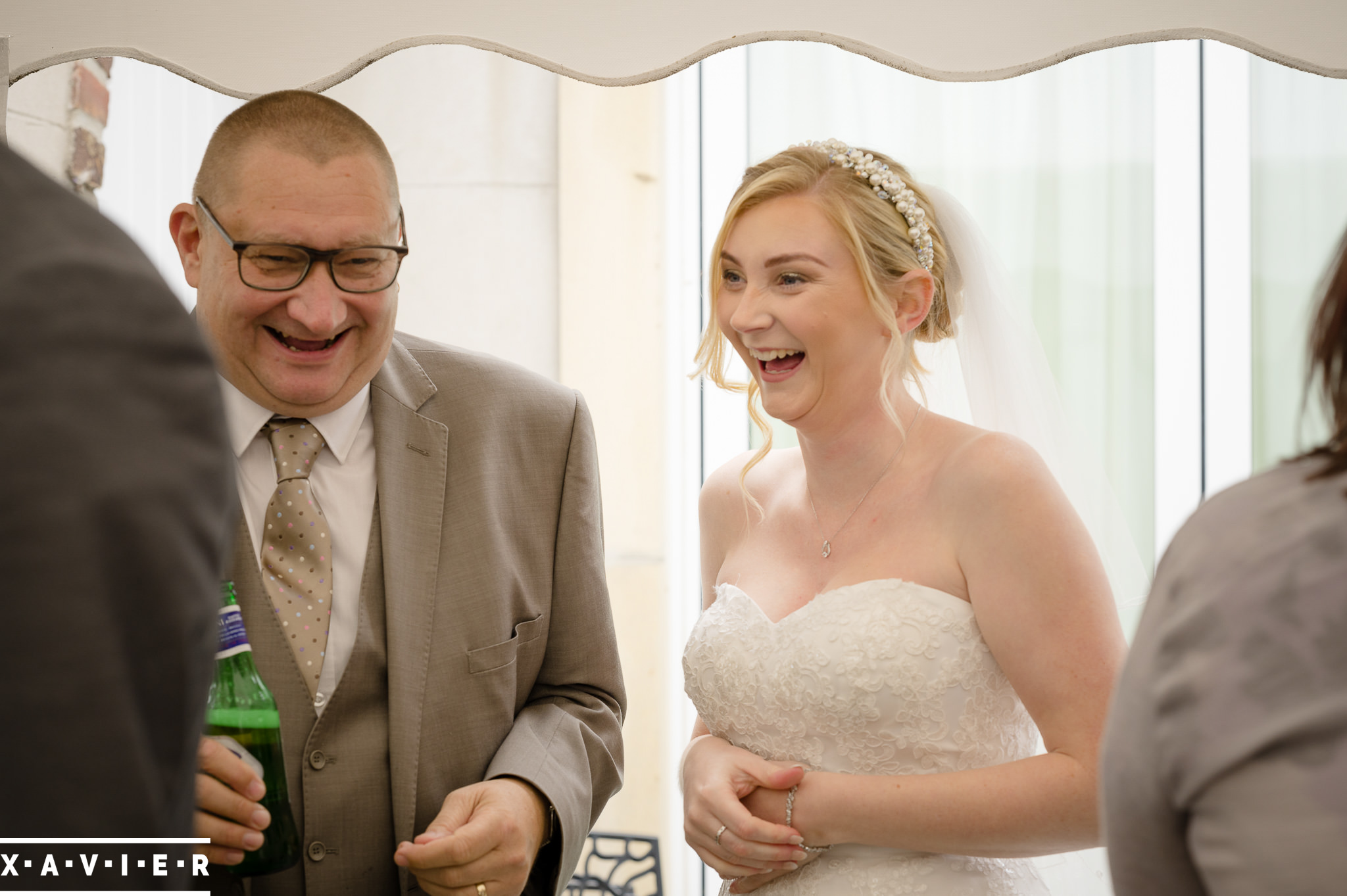 bride laughs with guests