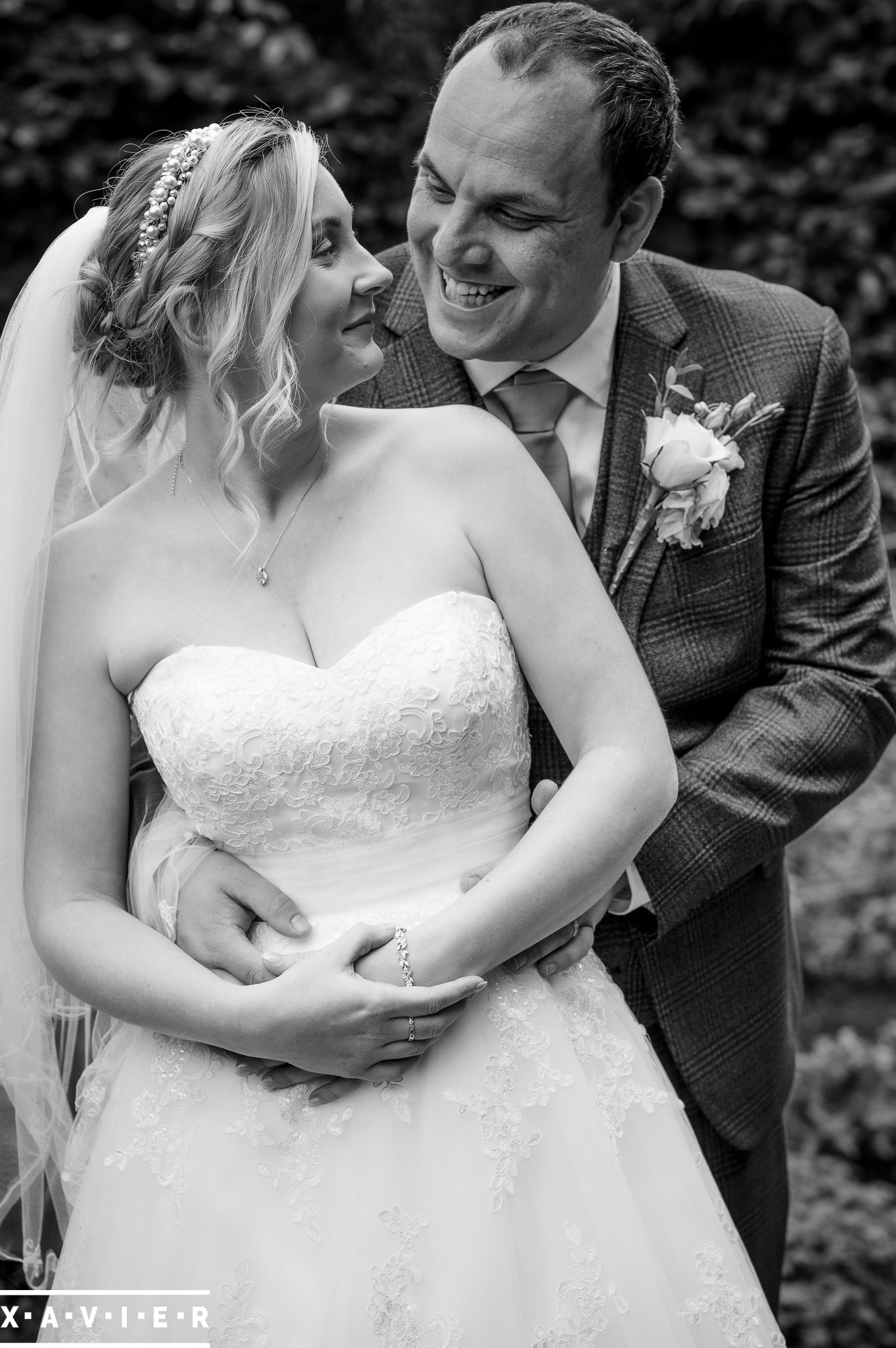 bride and groom laugh together