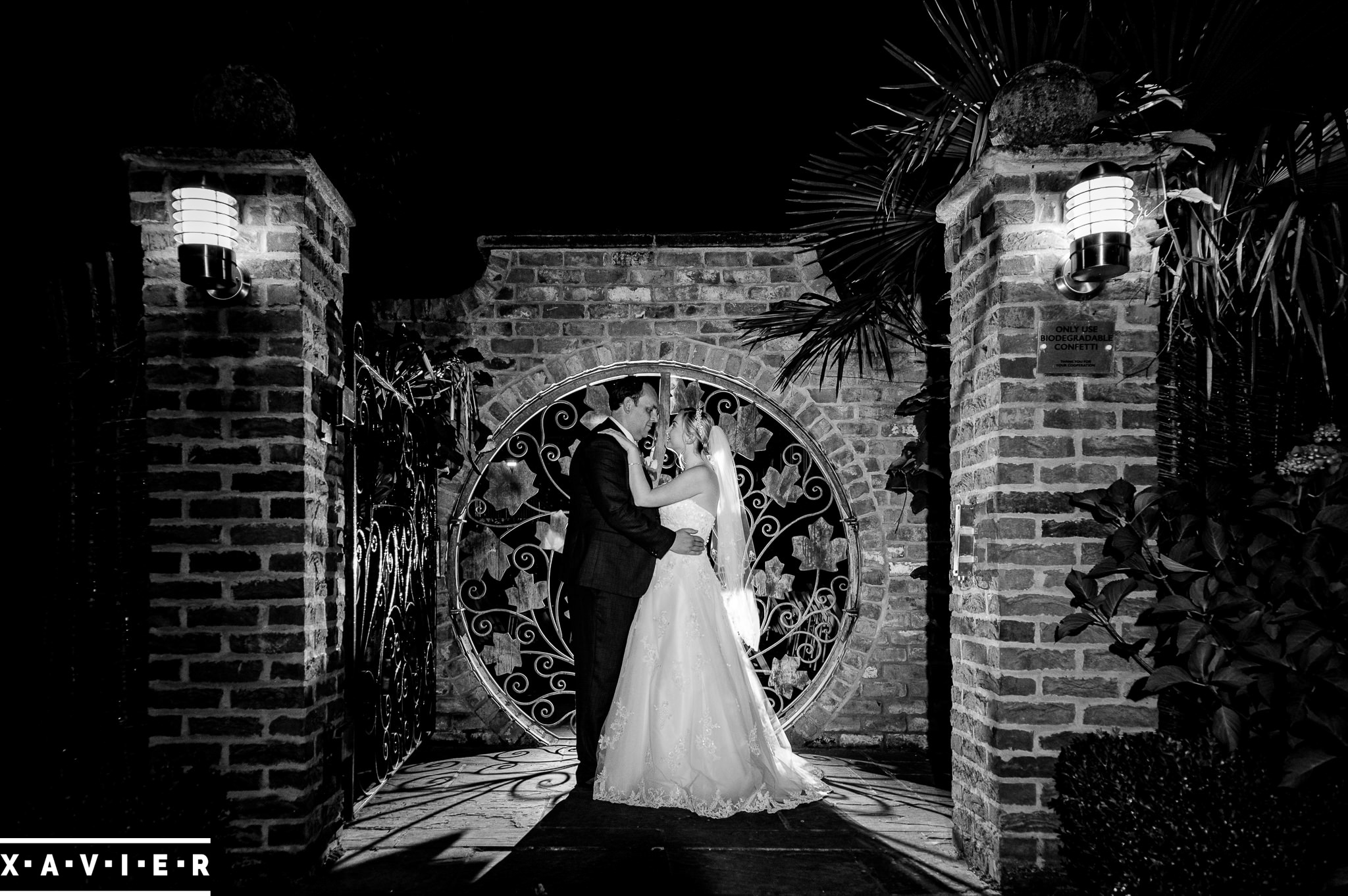bride and groom embrace in the dark