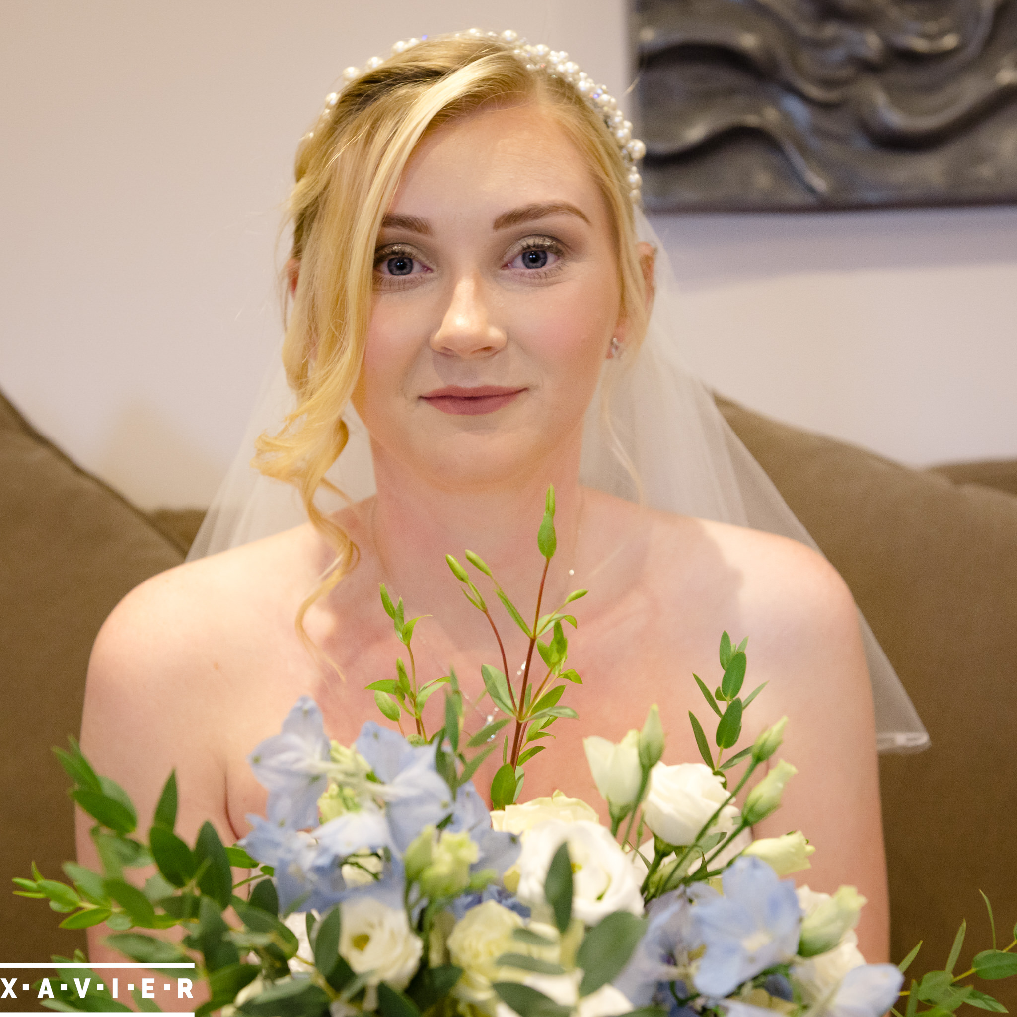 bride smiling with her flowers