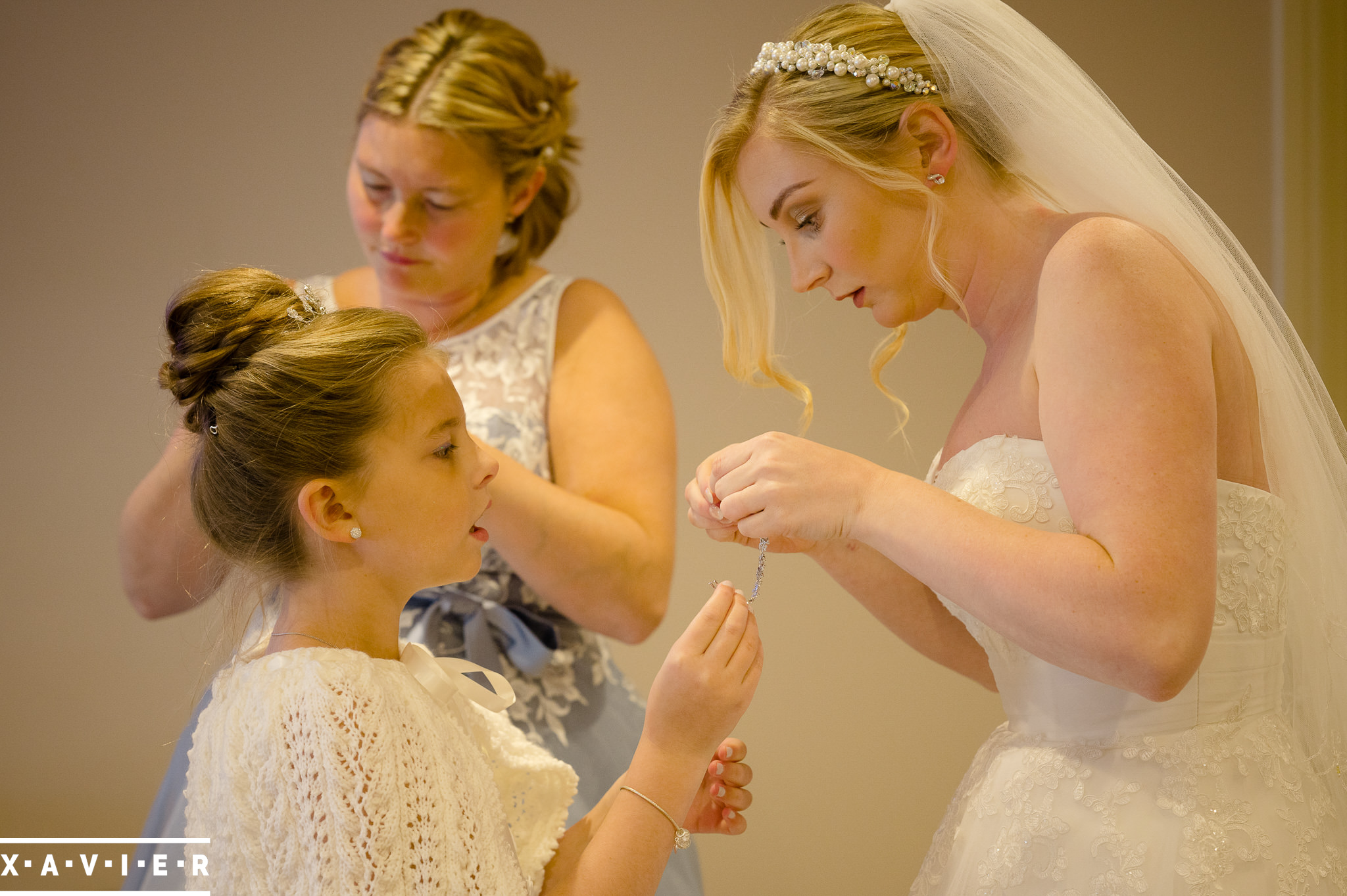 bride, bridesmaid and flowergirl are getting ready