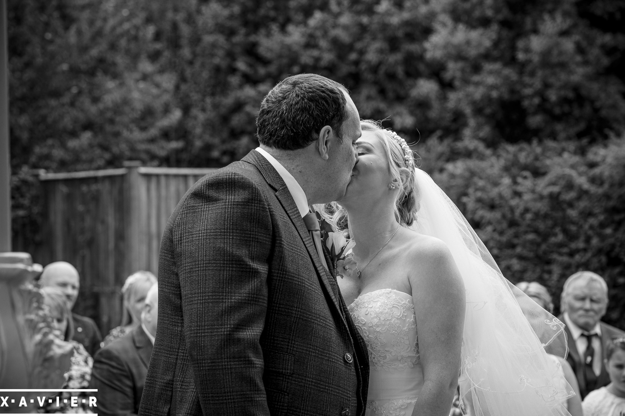 bride and groom have first kiss