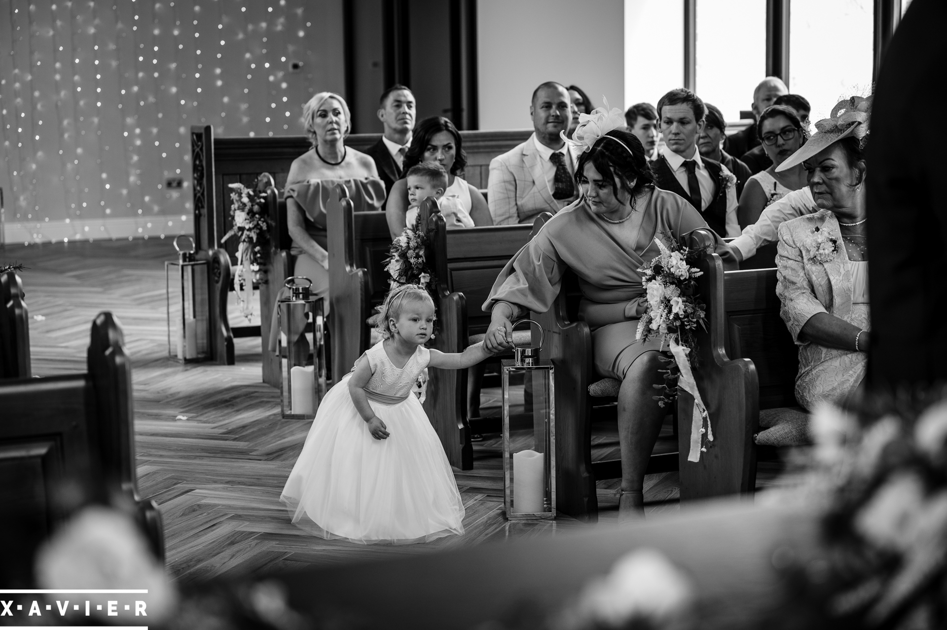 flowergirl leaves her seat during the ceremony