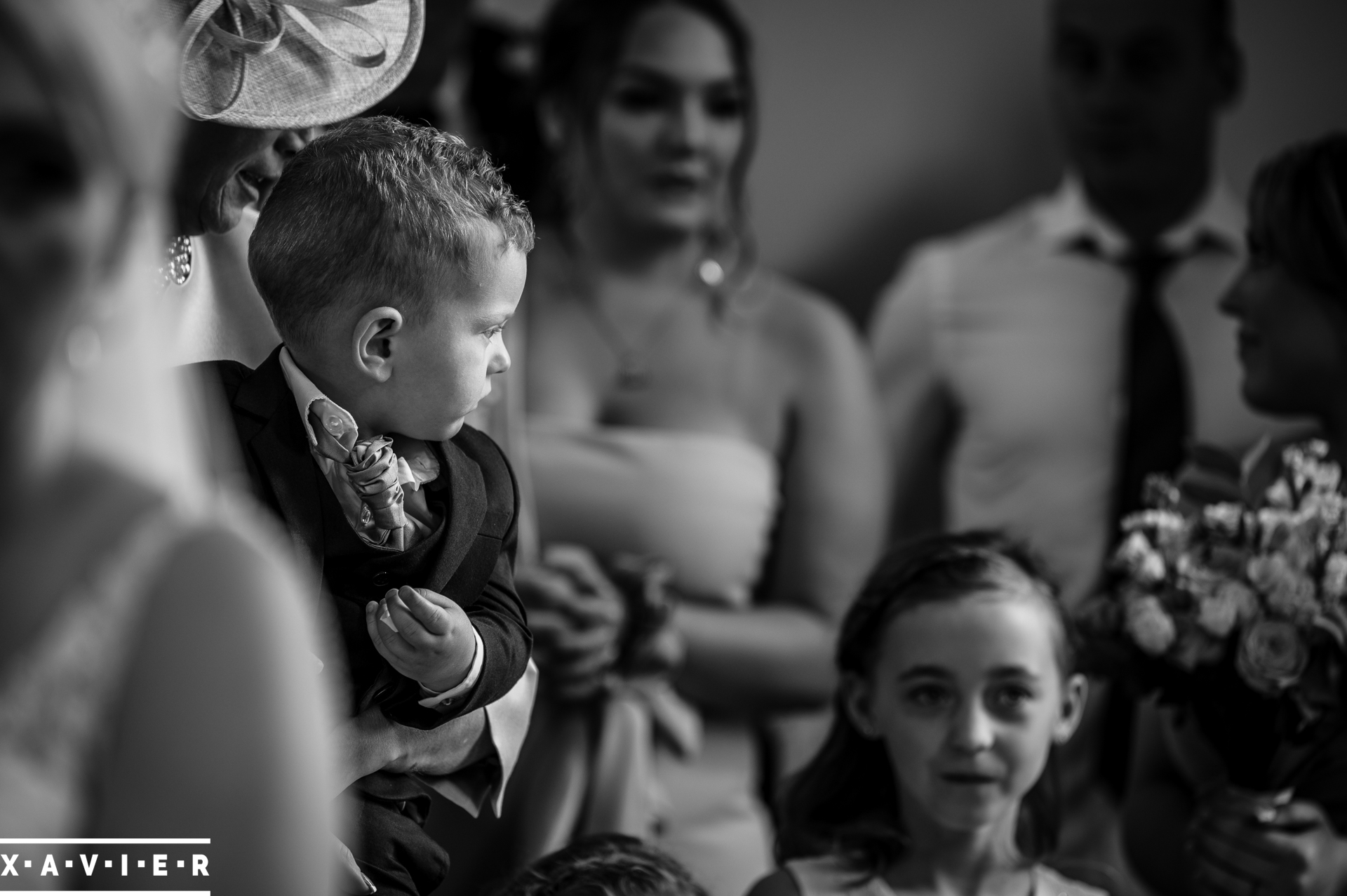 pageboy is distracted during the ceremony