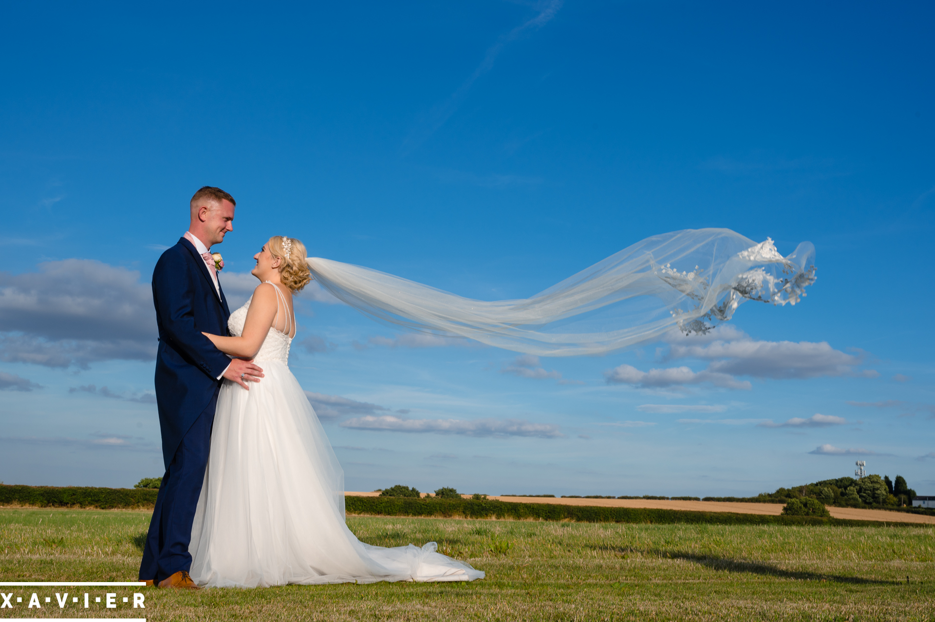 brides veil blows in the wind