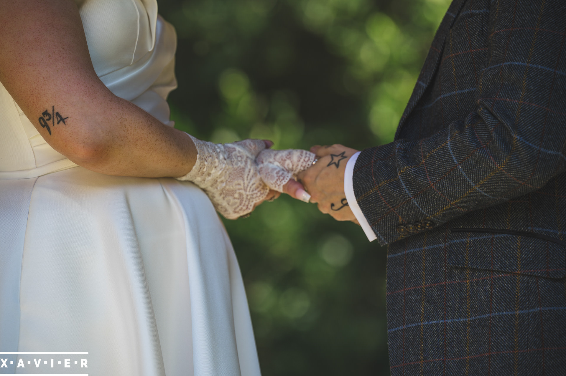 photo showing the close up of the bride and groom holding hands