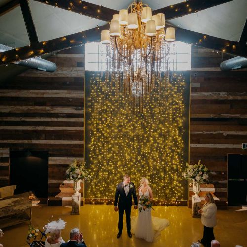 confetti falls onto the bride and groom