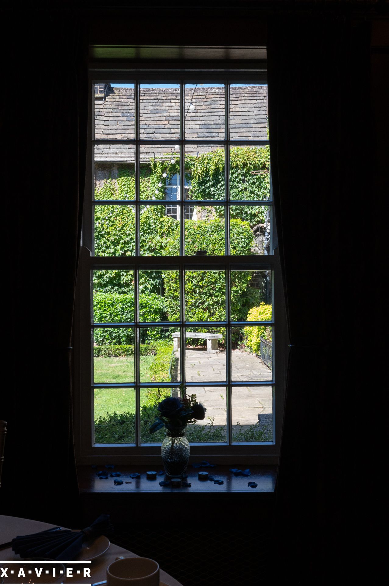 looking through window into the garden at whitley hall