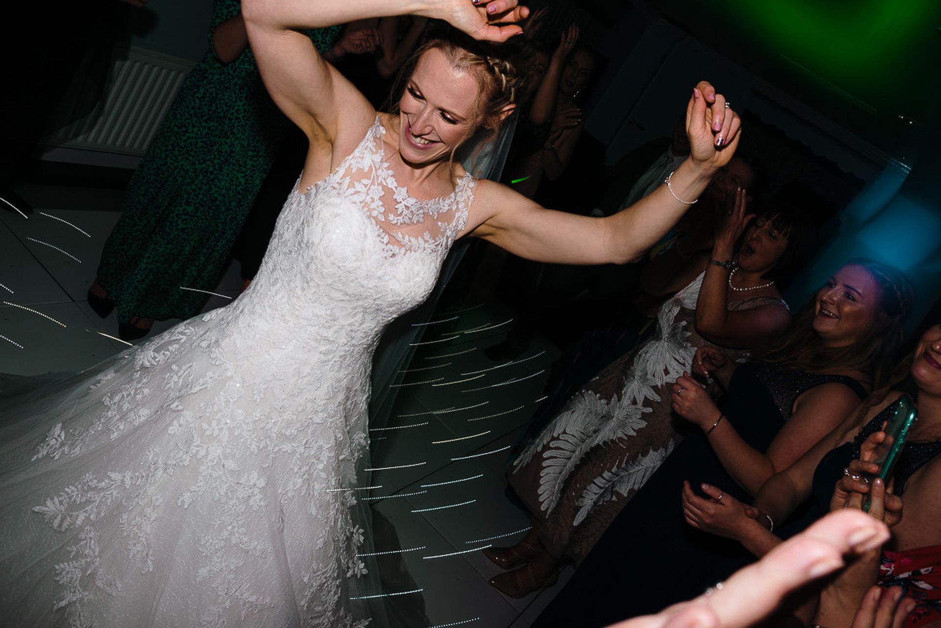 bride dances whilst others watch