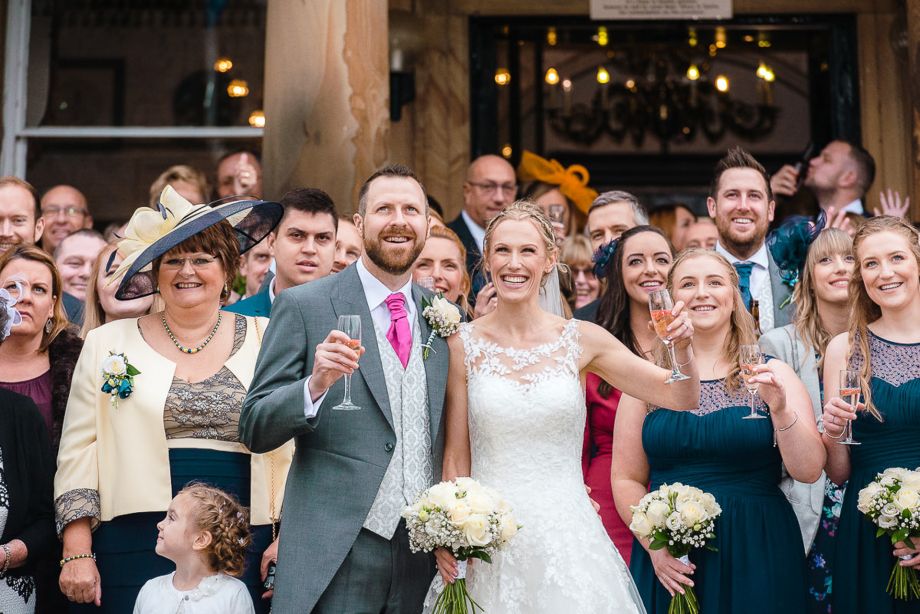 Bride-and-groom-celebrate-with-guests