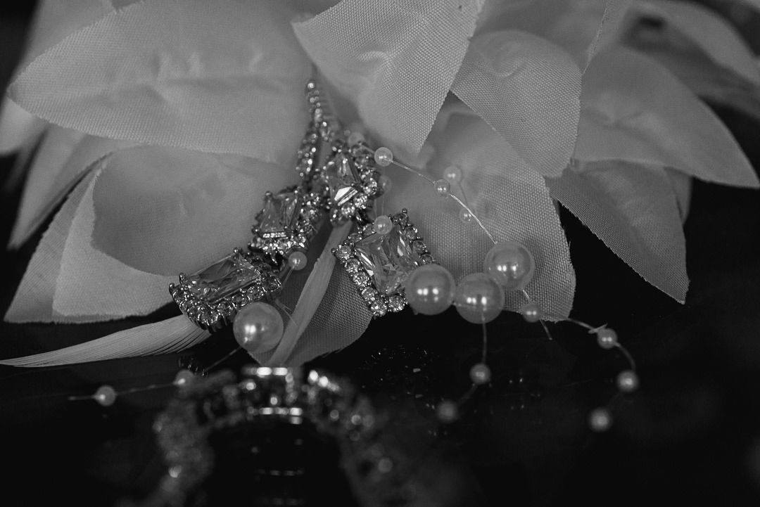close up, black and white image of the bride's jewellery