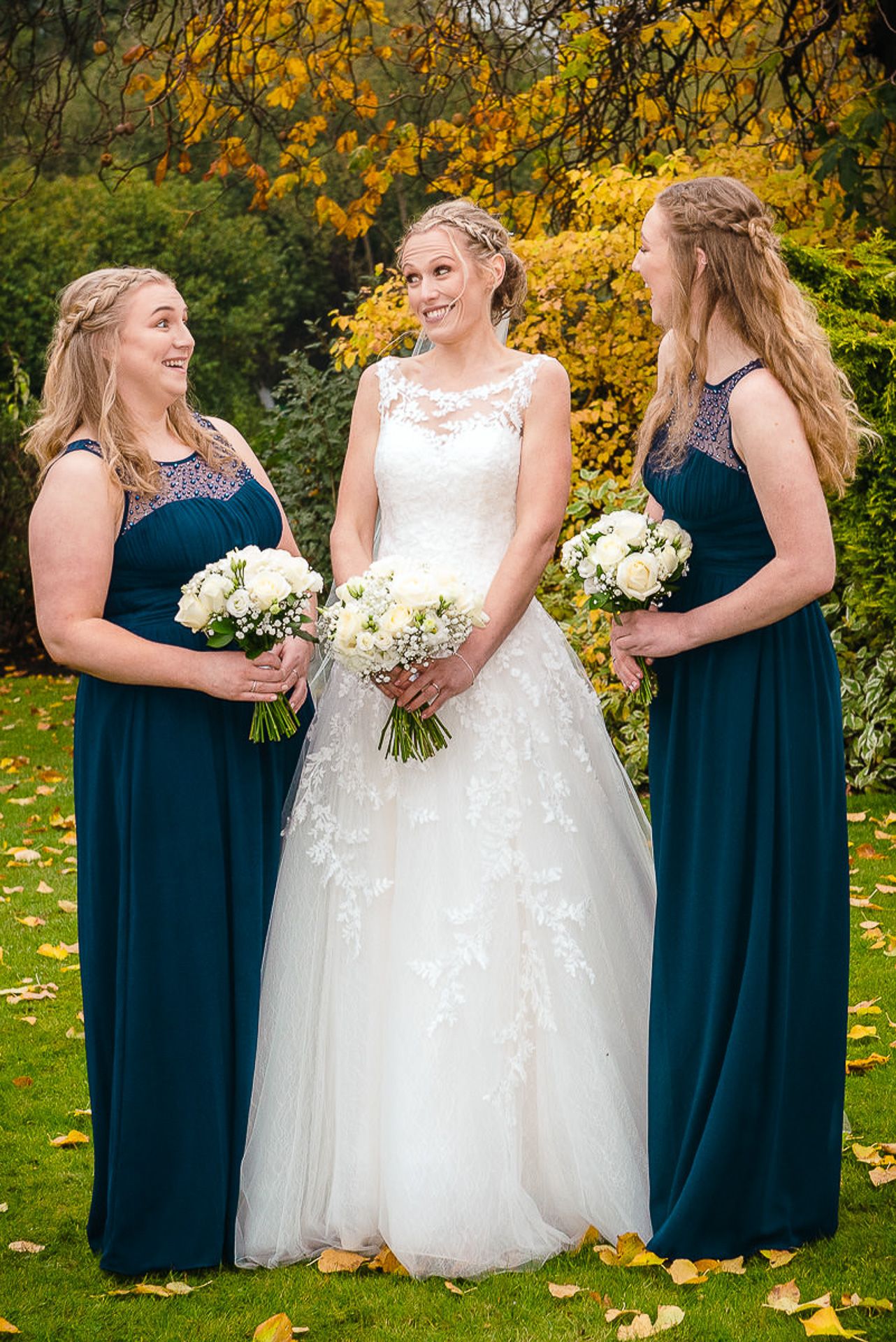 bride with bridesmaids, smiling