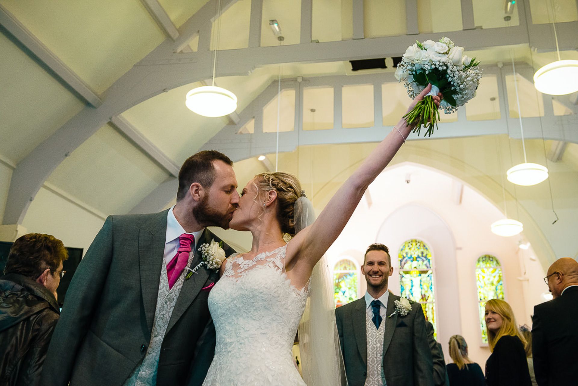 bride and groom walk down the aisle as husband and wife