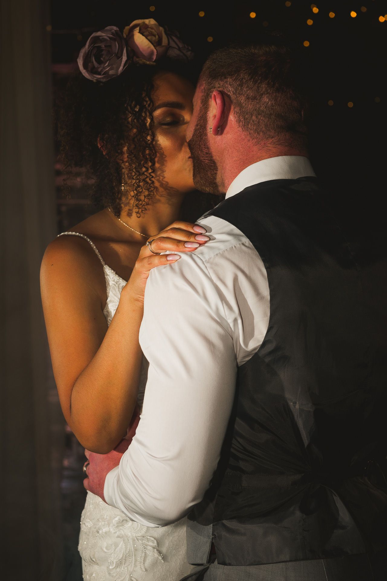 bride and groom kiss during their first dance